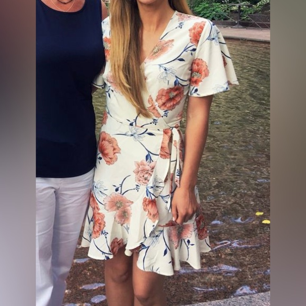Mini wrap dress purchased from Nordstrom - white with flowers. Worn once!